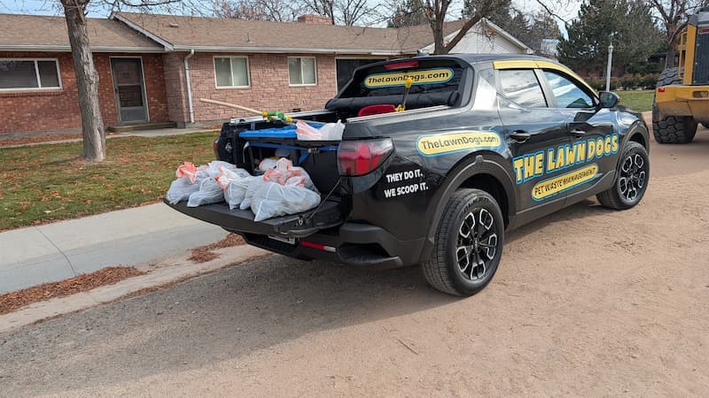 Bagged dog waste loaded for haul-away on a Lawn Dogs route in Boise