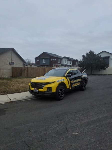 A Lawn Dogs technician on a route in Garden City, Idaho