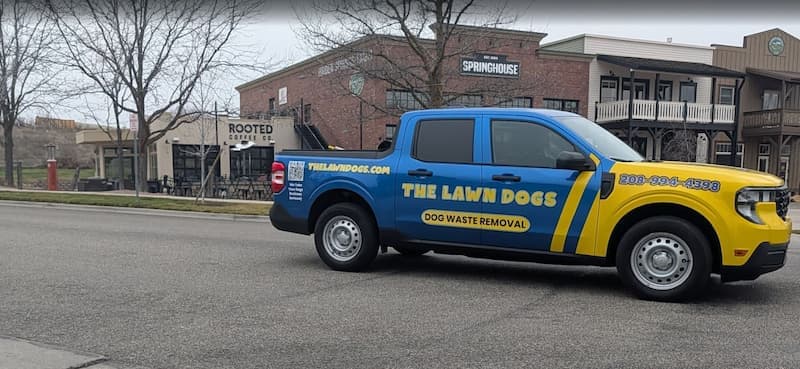 A wrapped Lawn Dogs truck parked outside the Springhouse in the Hidden Springs town center, north of Boise
