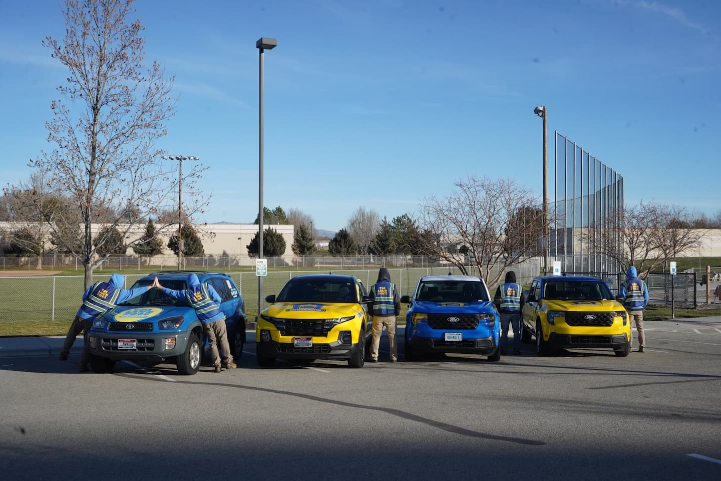 The full Lawn Dogs fleet and team after the Underdog Poop Scoop merger, Treasure Valley dog waste removal