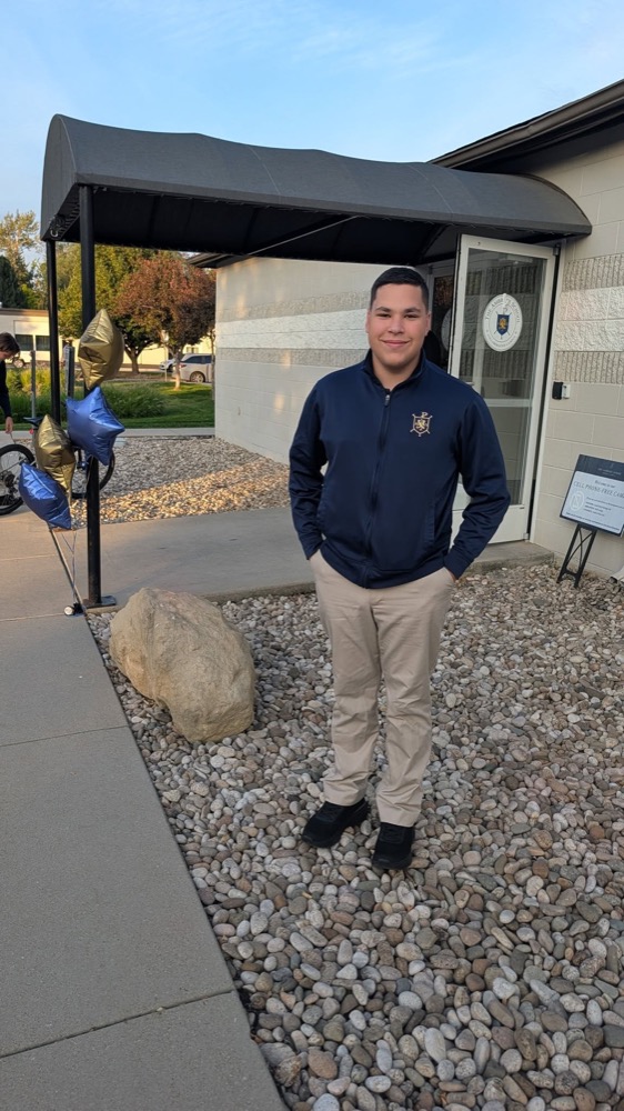 Manny Johns, the original Lawn Dog, outdoors in a navy jacket